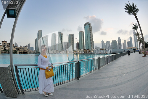 Image of happy tourist woman