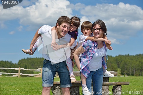 Image of happy young family have fun outdoors