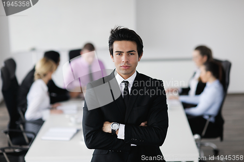 Image of young business man at meeting