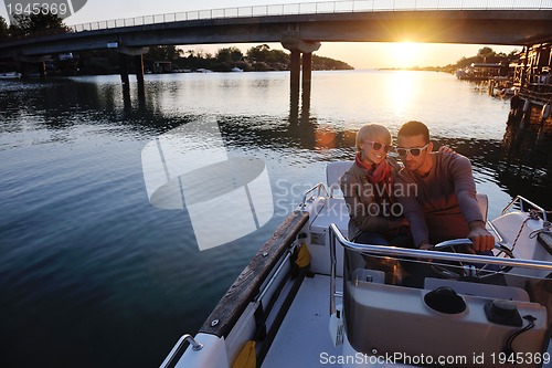 Image of couple in love  have romantic time on boat