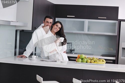 Image of young couple have fun in modern kitchen