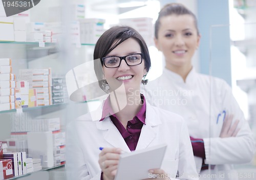 Image of team of pharmacist chemist woman  in pharmacy drugstore