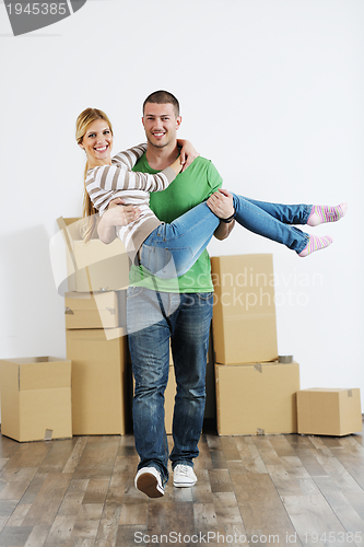 Image of Young couple moving in new house