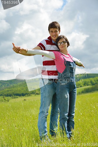 Image of romantic young couple in love together outdoor