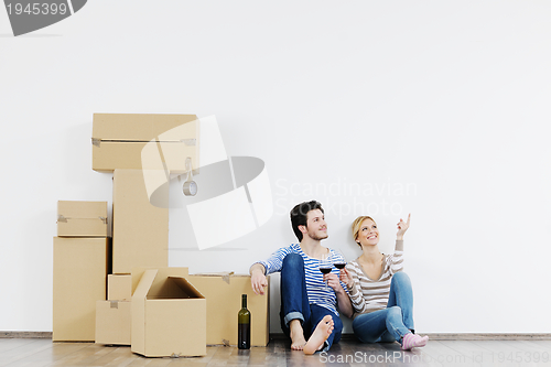 Image of Young couple moving in new house