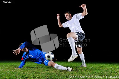 Image of football players in action for the ball