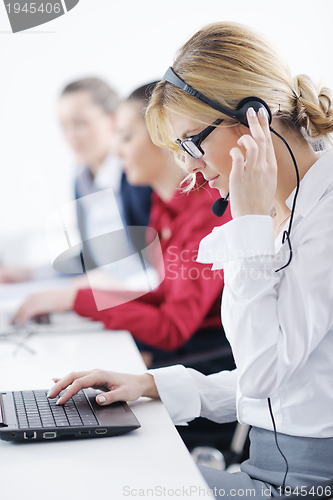 Image of business woman group with headphones