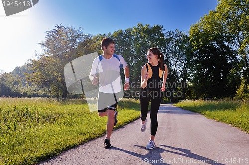 Image of Young couple jogging