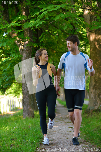 Image of Young couple jogging