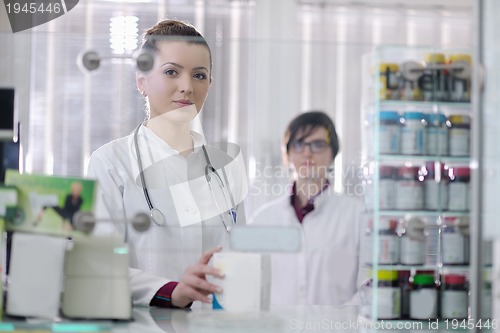 Image of team of pharmacist chemist woman  in pharmacy drugstore