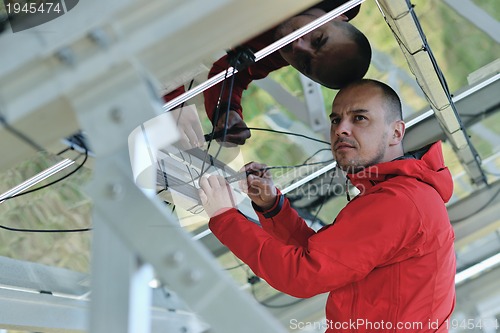 Image of Male solar panel engineer at work place