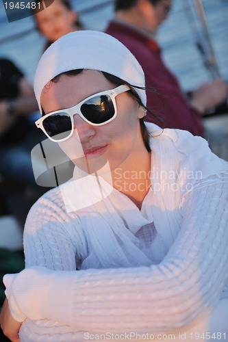 Image of Greek woman on the streets of Oia, Santorini, Greece