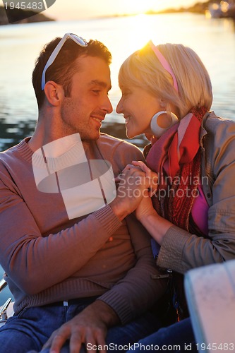 Image of couple in love  have romantic time on boat