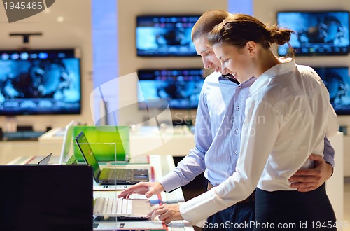 Image of people buy  in consumer electronics store