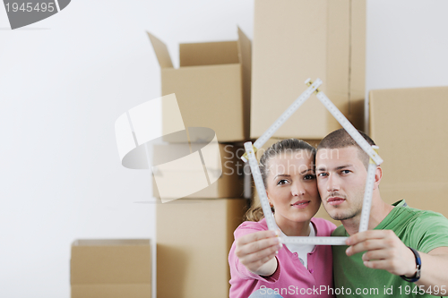 Image of Young couple moving in new house