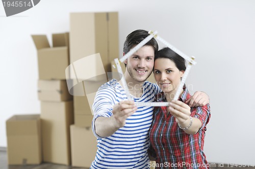 Image of Young couple moving in new home