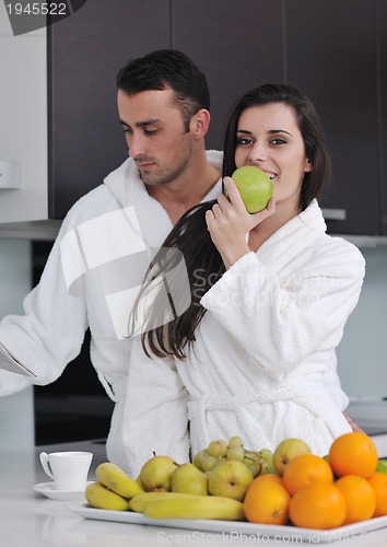 Image of young couple have fun in modern kitchen