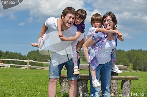 Image of happy young family have fun outdoors