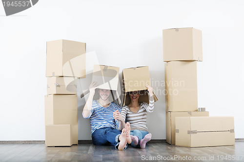 Image of Young couple moving in new house