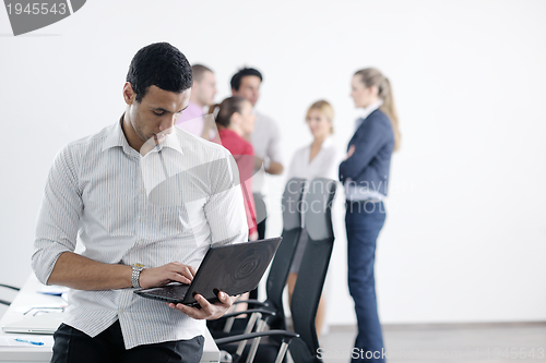 Image of young business man at meeting