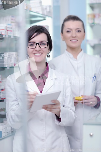 Image of team of pharmacist chemist woman  in pharmacy drugstore