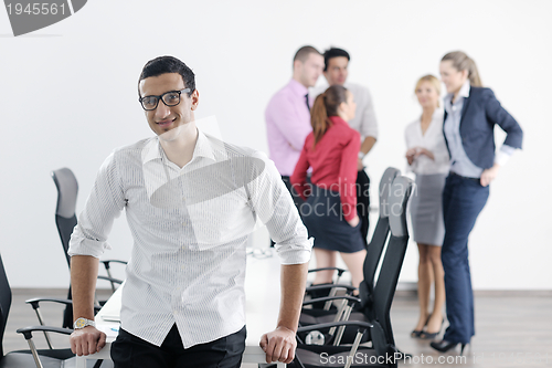 Image of young business man at meeting