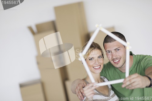 Image of Young couple moving in new home