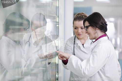 Image of team of pharmacist chemist woman  in pharmacy drugstore