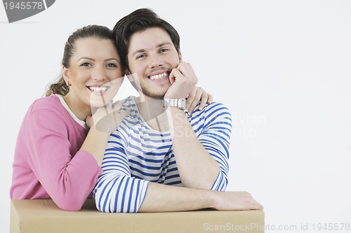 Image of Young couple moving in new home