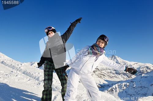 Image of winter portrait of friends at skiing