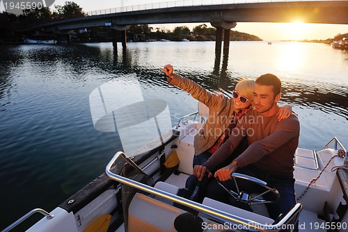 Image of couple in love  have romantic time on boat