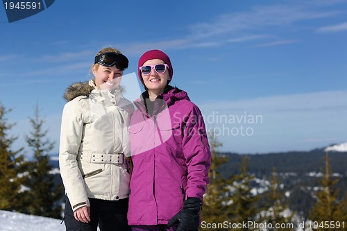 Image of winter season fun with group of girls