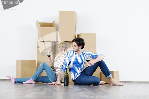 Image of Young couple moving in new house