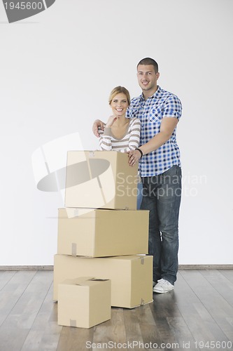 Image of Young couple moving in new home
