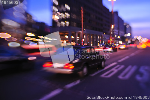 Image of City night with cars motion blurred light in busy street