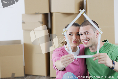 Image of Young couple moving in new house