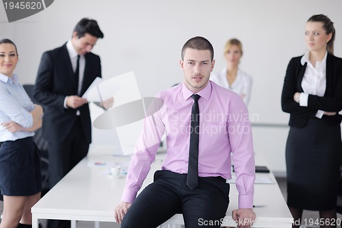 Image of young business man at meeting