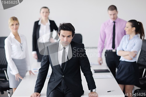 Image of young business man at meeting