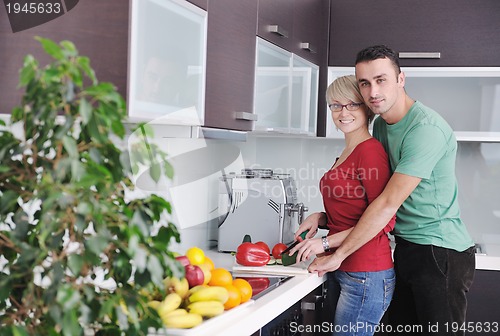 Image of young couple have fun in modern kitchen