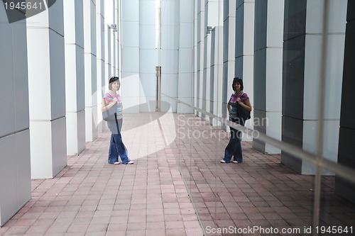 Image of beautiful young woman in the city