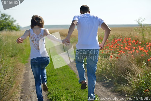 Image of happy couple in wheat field