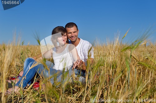 Image of happy couple in wheat field