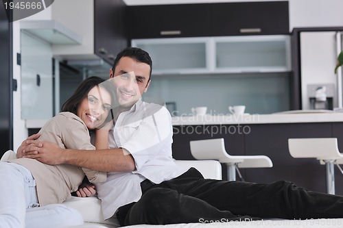 Image of happy young couple relax at home