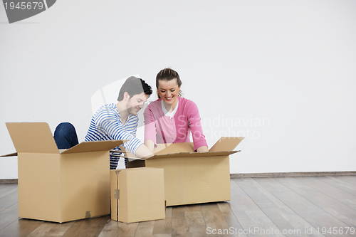 Image of Young couple moving in new home