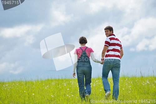 Image of romantic young couple in love together outdoor