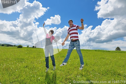 Image of romantic young couple in love together outdoor