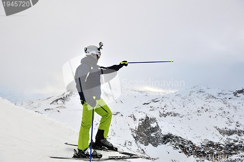 Image of skiing on fresh snow at winter season at beautiful sunny day