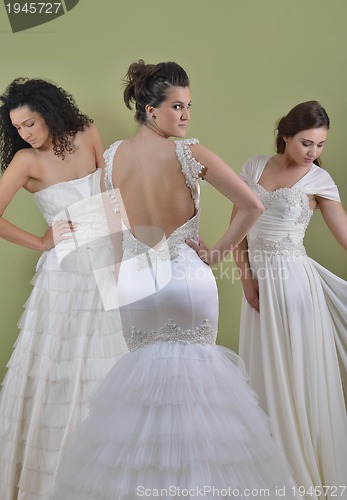 Image of portrait of a three beautiful woman in wedding dress