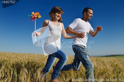 Image of happy couple in wheat field