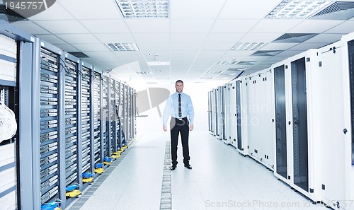 Image of young it engeneer in datacenter server room